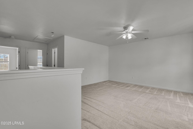 carpeted empty room featuring ceiling fan