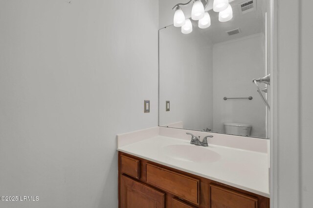 bathroom featuring vanity and toilet