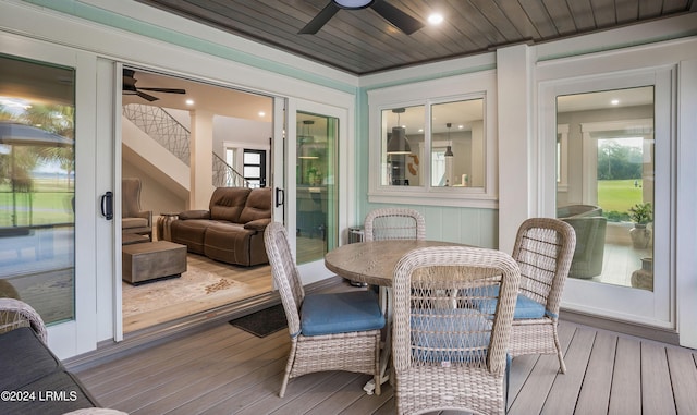 sunroom / solarium with wood ceiling and ceiling fan