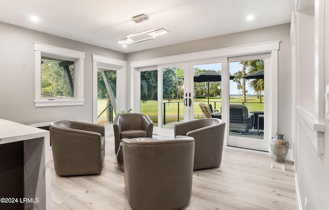 interior space with light hardwood / wood-style flooring and french doors