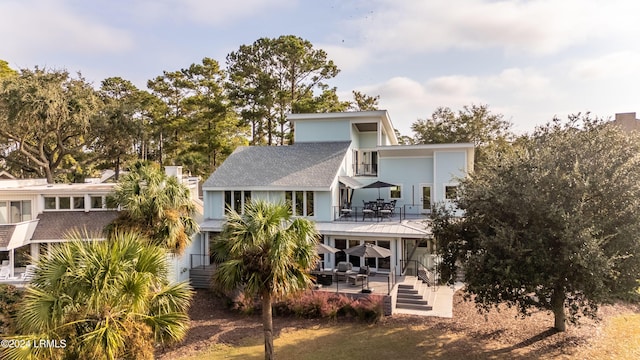 back of house with a patio area