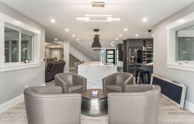 interior space featuring sink and light hardwood / wood-style flooring