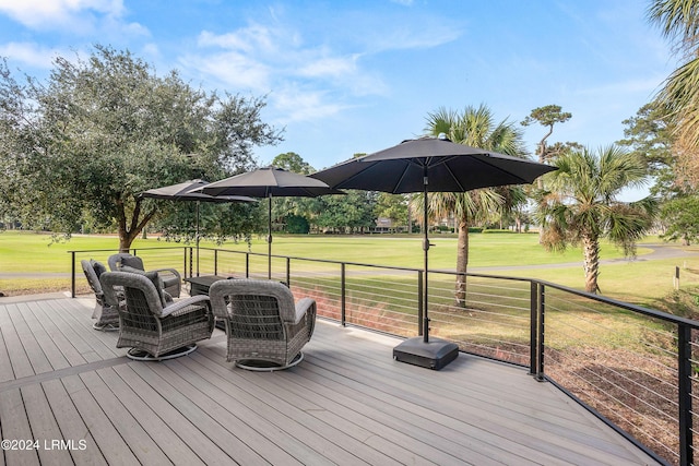 wooden terrace with a yard