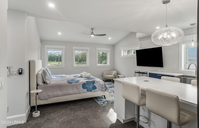 bedroom with vaulted ceiling, sink, ceiling fan, and a wall unit AC