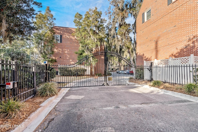 view of gate featuring fence