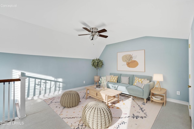 living room with vaulted ceiling, carpet floors, ceiling fan, and baseboards