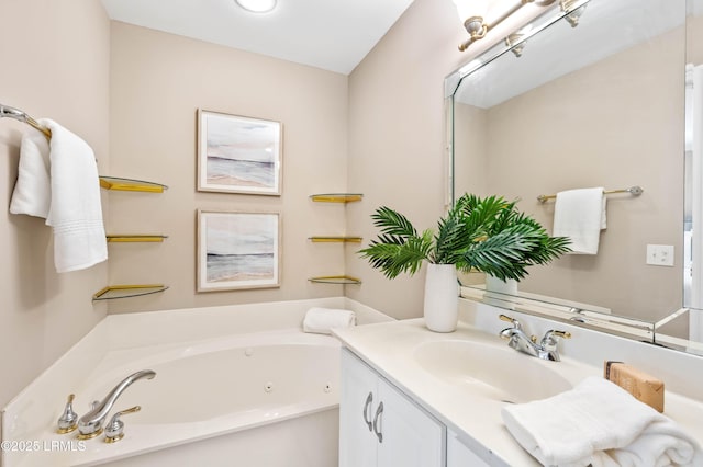 full bathroom featuring a whirlpool tub and vanity