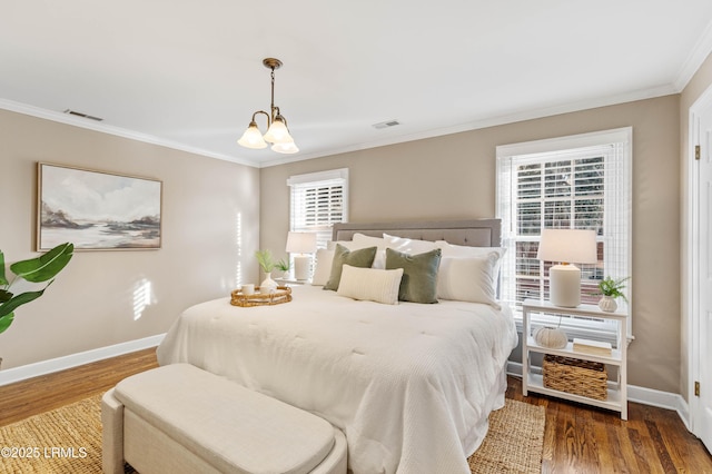 bedroom featuring a chandelier, dark wood-type flooring, visible vents, and baseboards