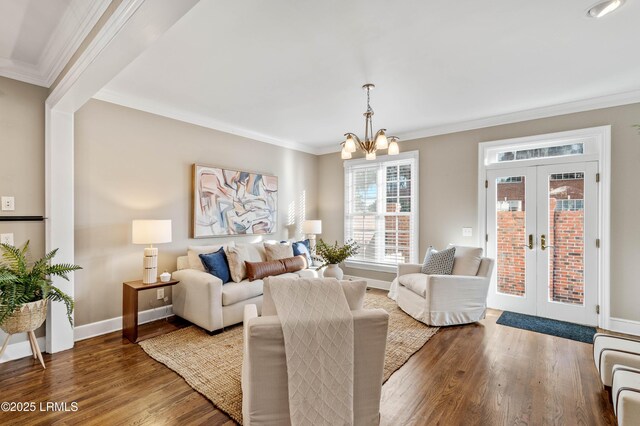 895 Ribaut Rd Unit 8, Beaufort, SC 29902 - living area featuring wood finished floors, french doors, a chandelier, ornamental molding, and baseboards