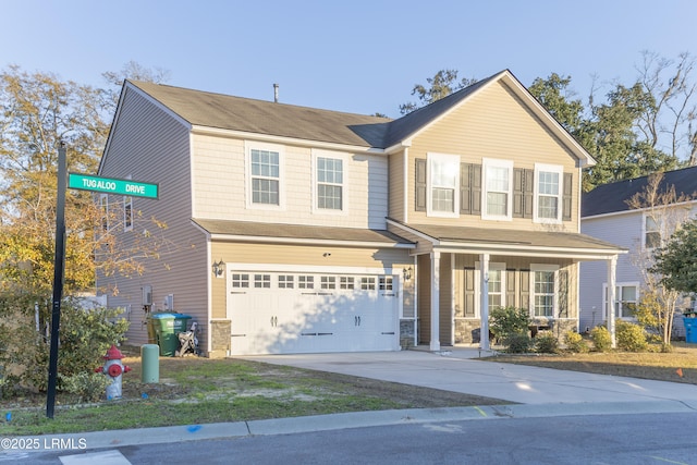 view of front facade featuring a garage and covered porch