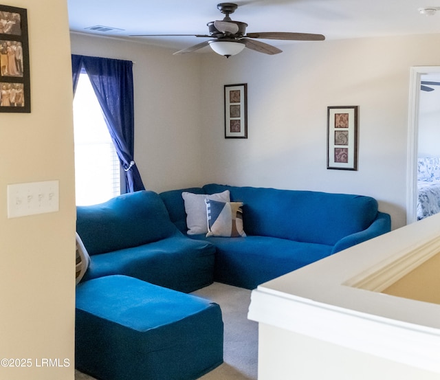 living room with ceiling fan