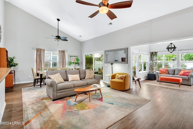 living room with hardwood / wood-style floors, plenty of natural light, high vaulted ceiling, and ceiling fan