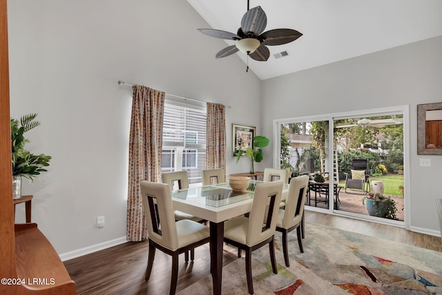 dining room with high vaulted ceiling, dark hardwood / wood-style floors, and ceiling fan