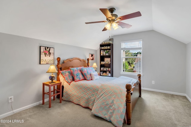 carpeted bedroom featuring vaulted ceiling and ceiling fan