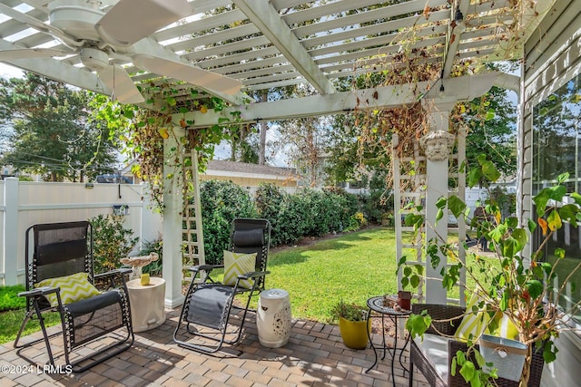 view of patio with ceiling fan and a pergola