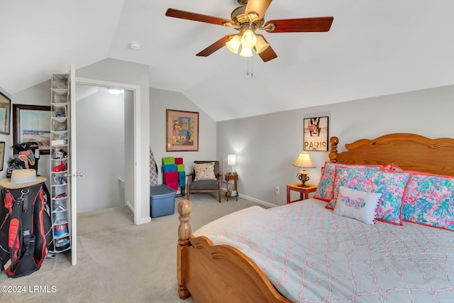 bedroom featuring vaulted ceiling, ceiling fan, and carpet floors