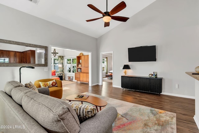 living room with high vaulted ceiling, dark hardwood / wood-style floors, and ceiling fan