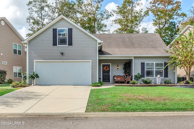 front of property with a garage and a front lawn