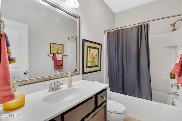 full bathroom with vanity, shower / tub combo with curtain, and toilet