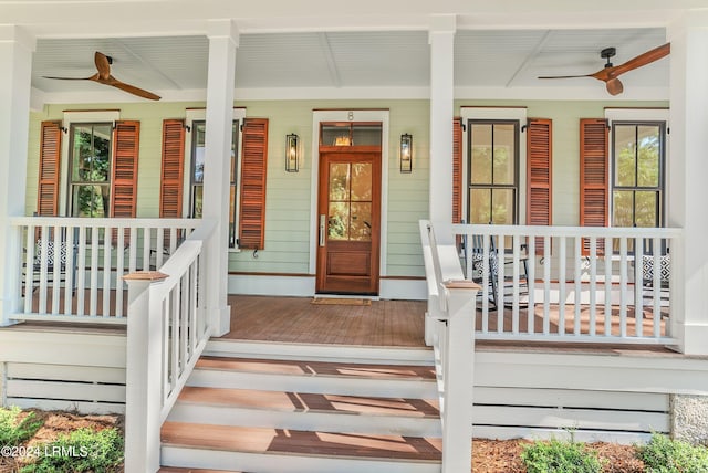 view of exterior entry featuring ceiling fan and covered porch