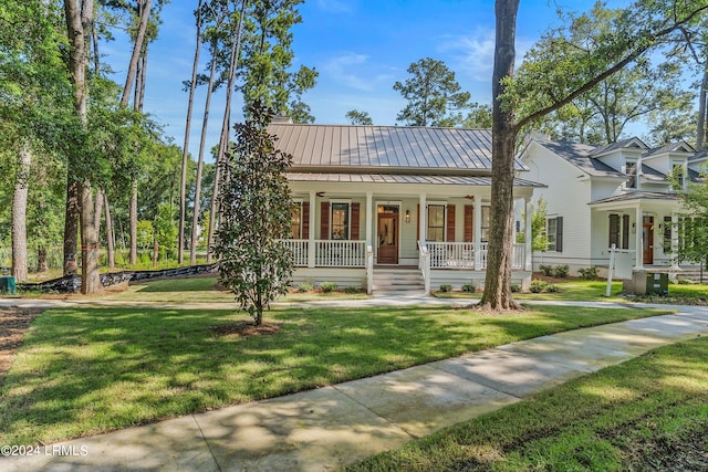 view of front of house featuring a front yard and a porch