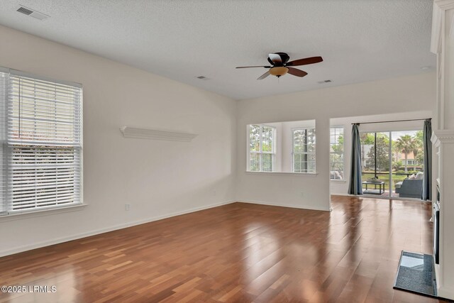 34 Basket Walk Dr, Okatie, SC 29909 - unfurnished room with ceiling fan, visible vents, a wealth of natural light, and wood finished floors