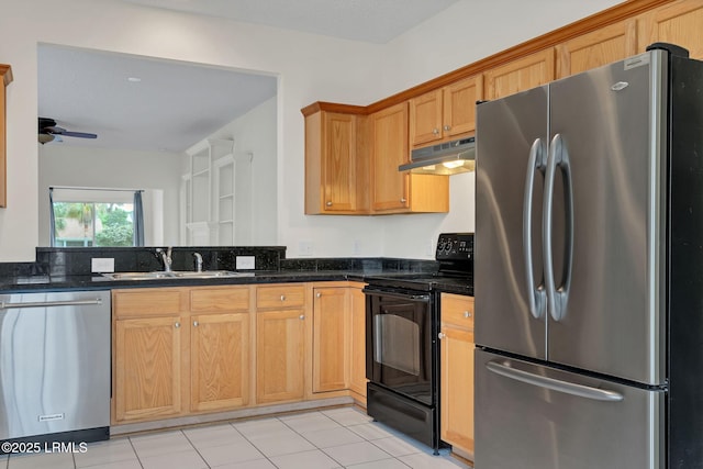 34 Basket Walk Dr, Okatie, SC 29909 - kitchen with ceiling fan, a sink, dark stone countertops, stainless steel appliances, and under cabinet range hood