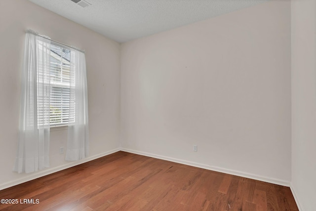 34 Basket Walk Dr, Okatie, SC 29909 - empty room featuring baseboards, wood finished floors, and a wealth of natural light