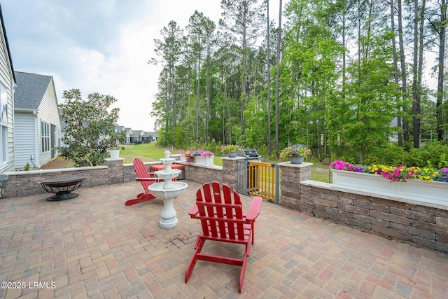view of patio / terrace featuring fence private yard and a gate