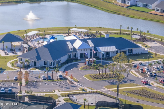 birds eye view of property with a water view