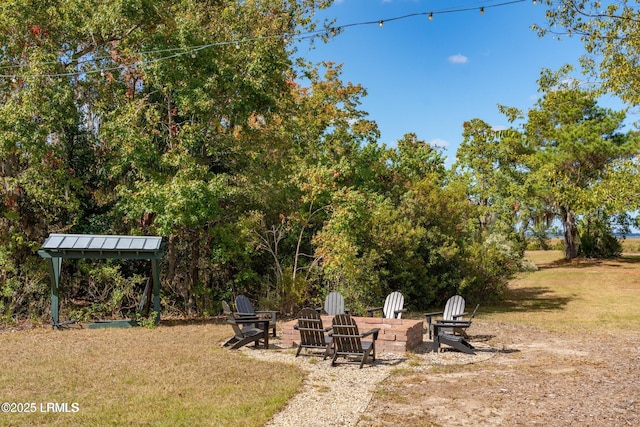 view of yard featuring a fire pit