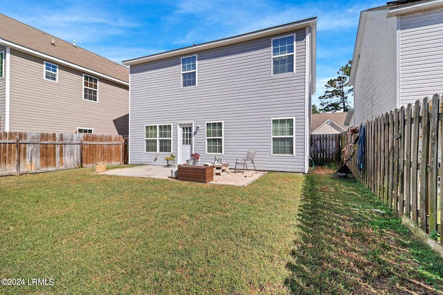 back of property featuring a patio and a lawn