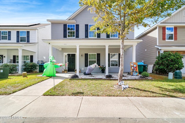 view of front of home featuring central AC, covered porch, and a front lawn