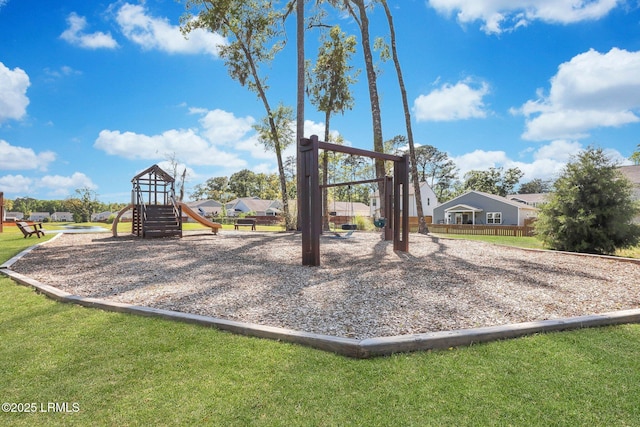 community jungle gym featuring a lawn