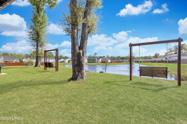 view of yard with a water view and a residential view