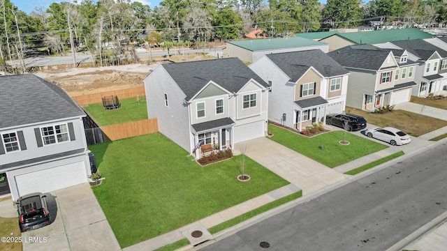 birds eye view of property with a residential view