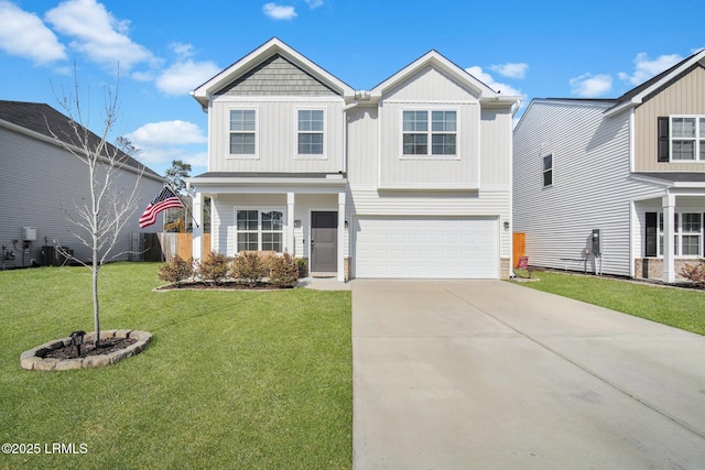 view of front of house featuring a garage, driveway, board and batten siding, and a front yard