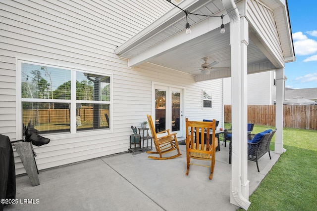 view of patio / terrace featuring ceiling fan and fence