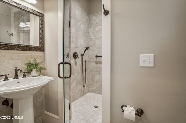 bathroom with an enclosed shower and decorative backsplash