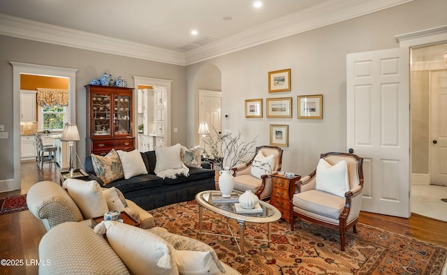 living room featuring crown molding and dark wood-type flooring