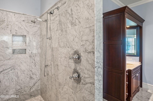 bathroom featuring vanity, crown molding, and tiled shower