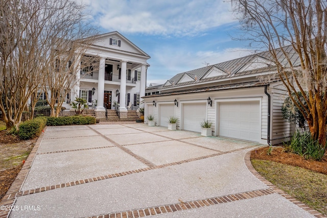 greek revival house with a garage