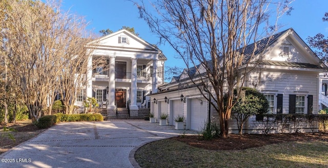 neoclassical home with a garage