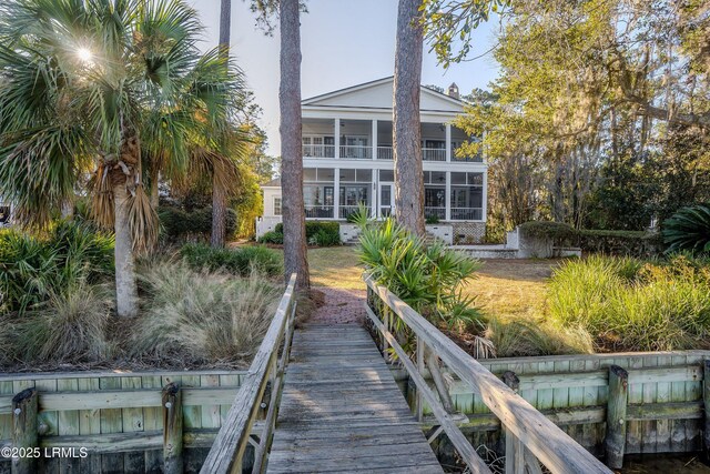 back of property featuring a sunroom