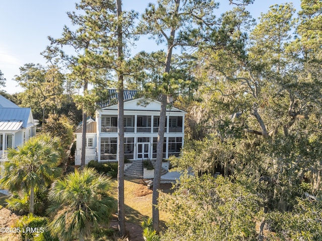 back of property featuring a sunroom