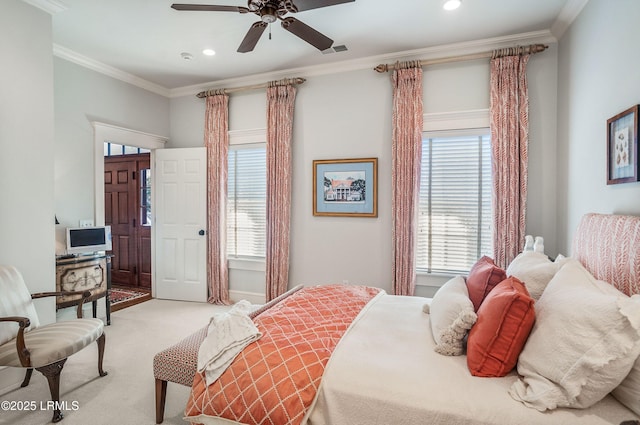 carpeted bedroom featuring ornamental molding and ceiling fan