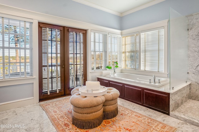 bathroom featuring a bath and ornamental molding