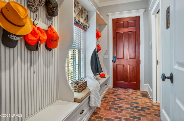 mudroom featuring ornamental molding