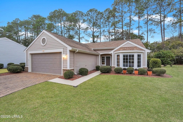 ranch-style house with a garage and a front lawn