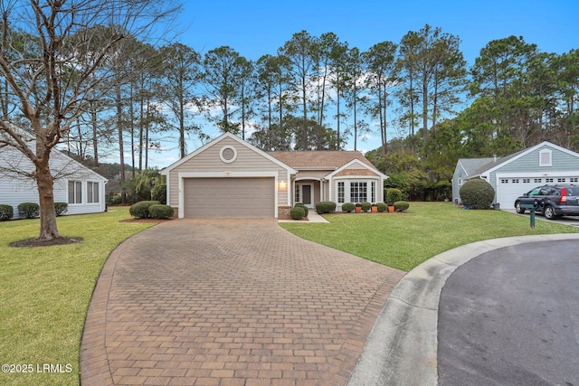 ranch-style home with a garage and a front lawn